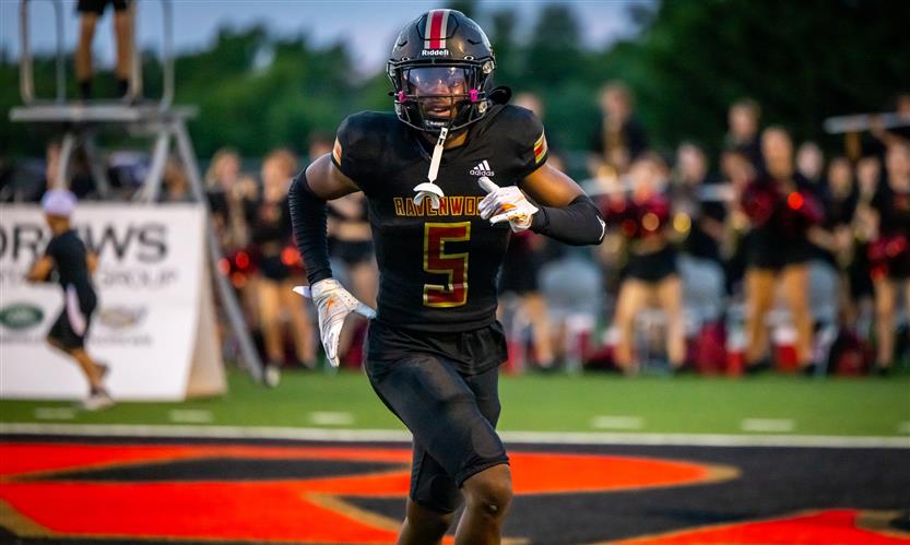 A football player runs on the field